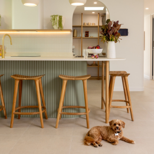 Kitchen bench with stools and a small dog lying on the floor