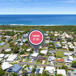 Aerial shot showing the proximity of our Coolum Prize Home to the beach on a sunny day. There is a bubble saying "here it is".