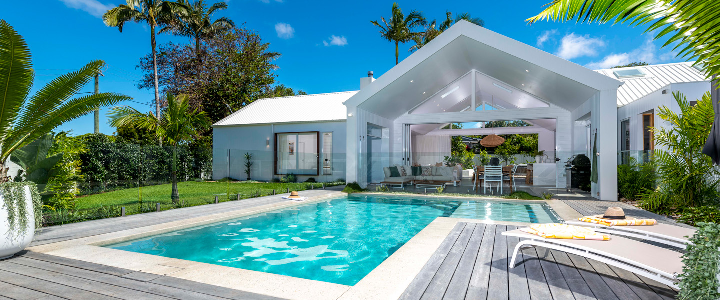 Kingscliff prize home 521. Full view of front of house with the pool in the foreground