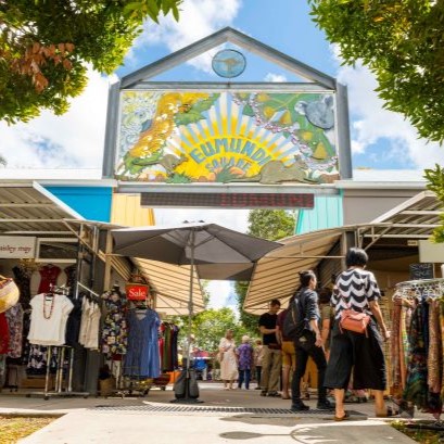 Eumundi Markets sign with shops below