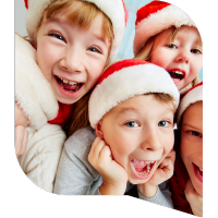 Children in santa hats laughing