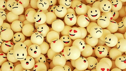 yellow balls with emoji faces