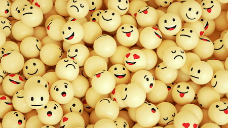 yellow balls with emoji faces